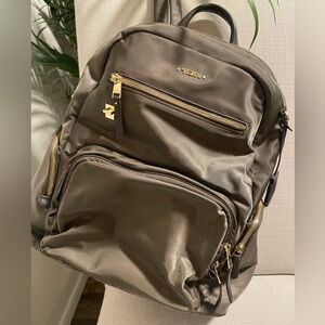 Tumi deep taupe backpack with Gold Accent